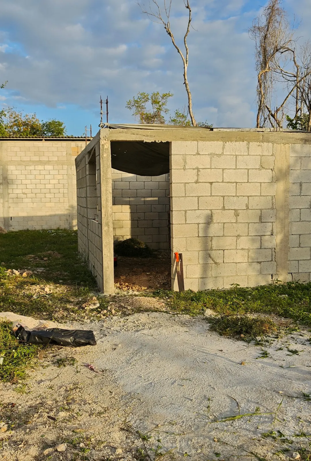 The first course of concrete block walls on a new slab