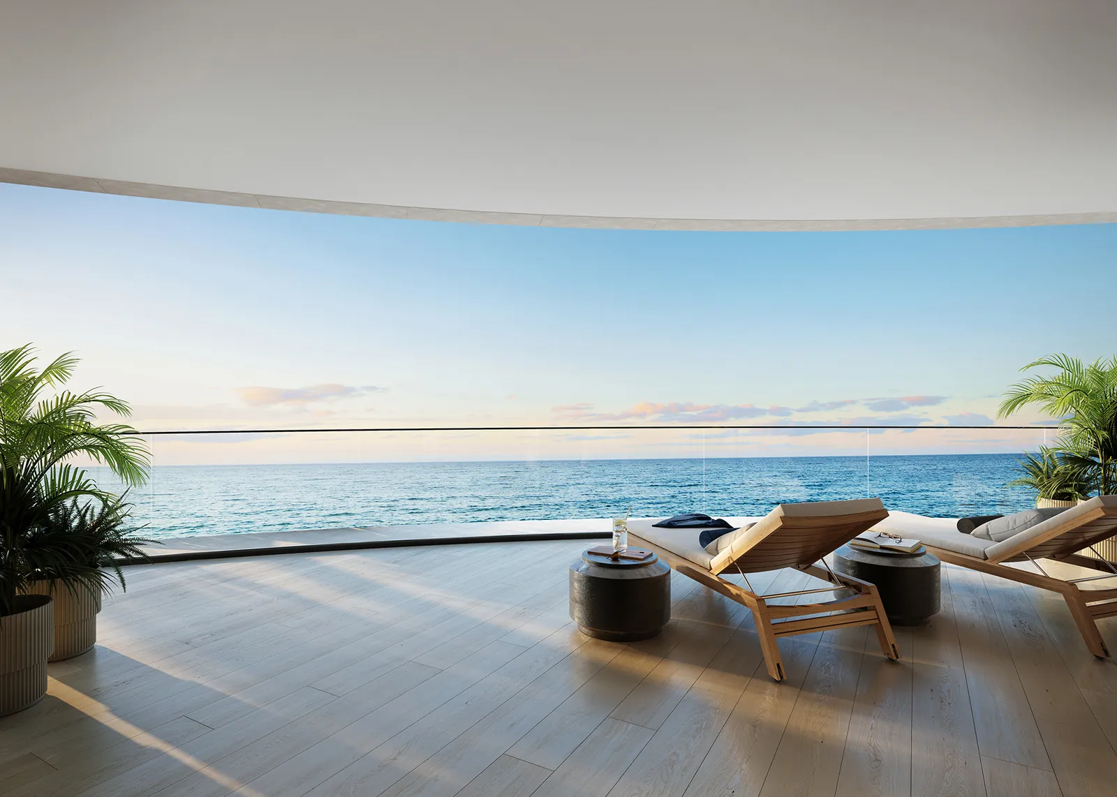 A living room that opens to a wide terrace over the ocean