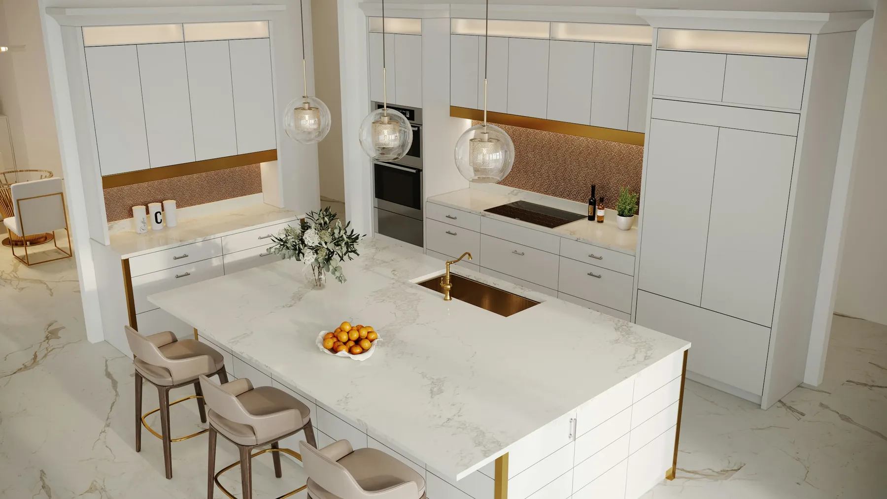 A white marble kitchen island with brass accents and glass pendants