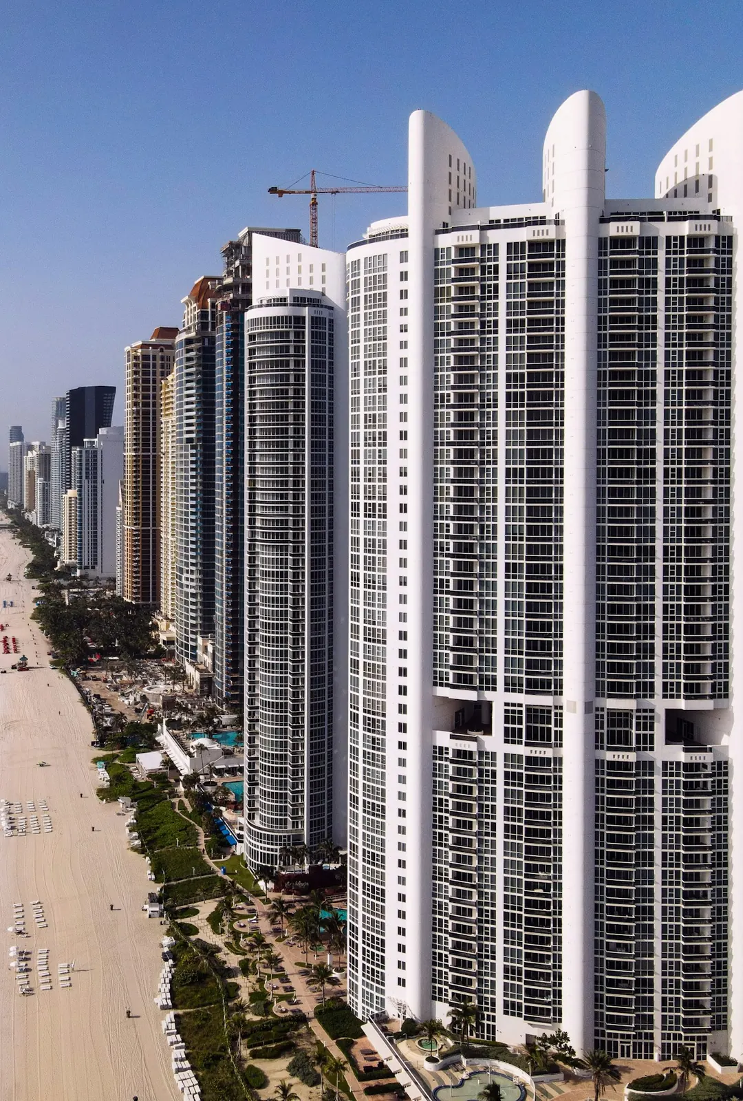 Finished residential towers along the ocean