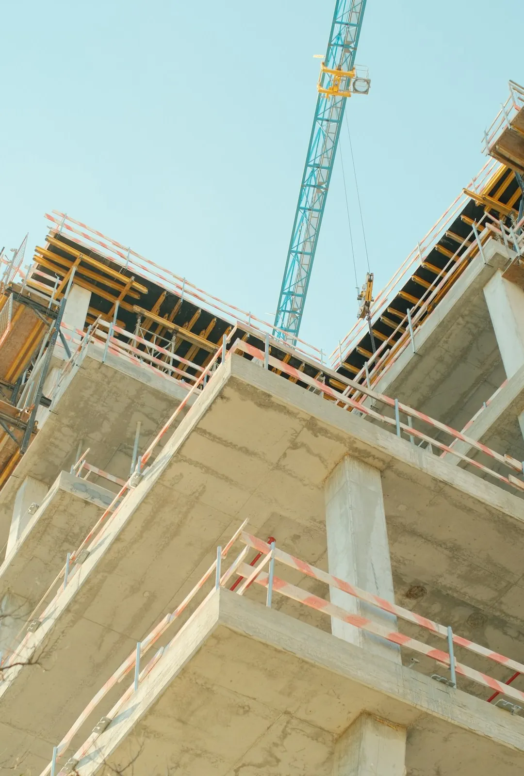 A concrete tower with its balcony slabs poured