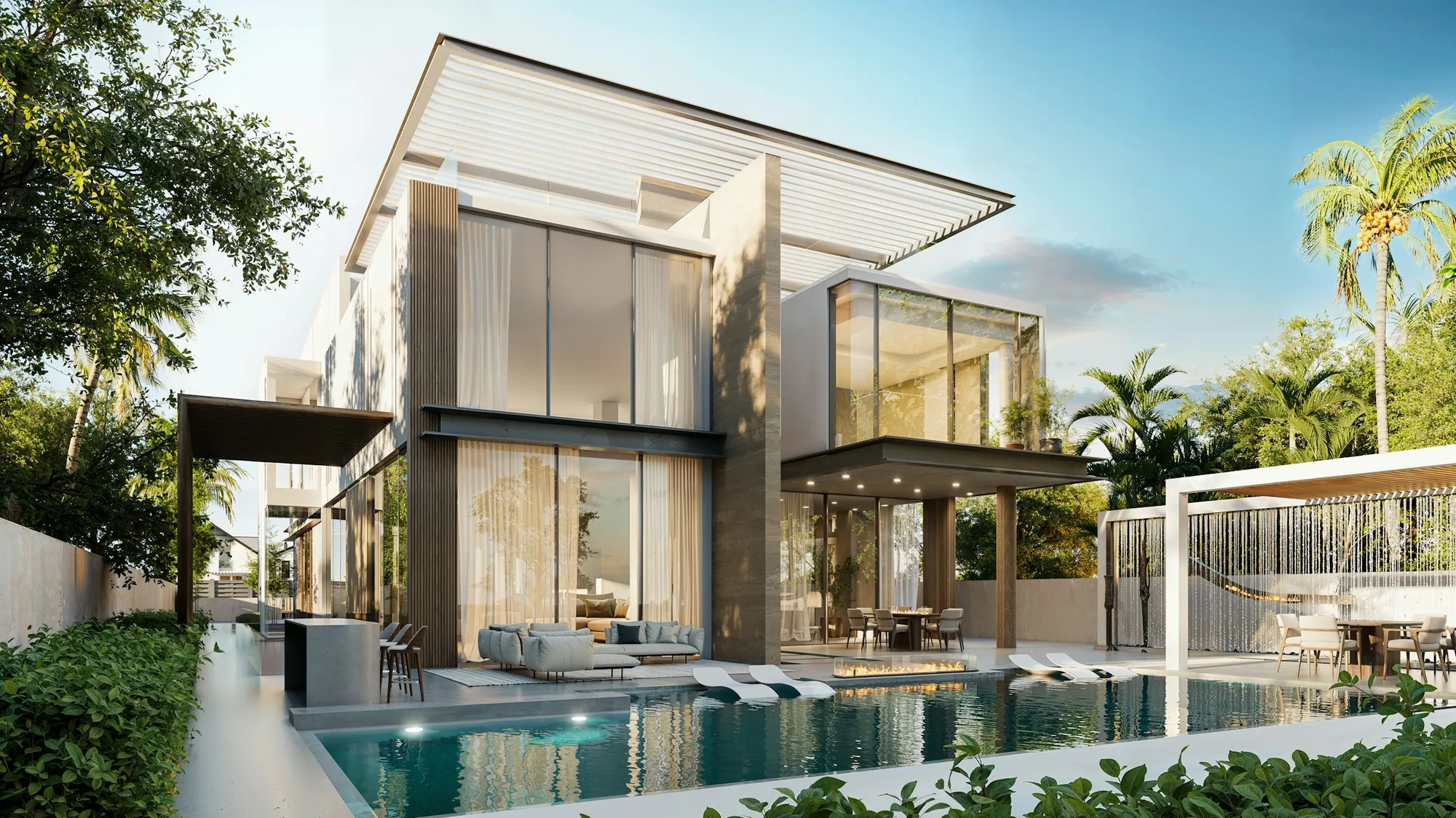 A modern estate home with walls of glass and a pool